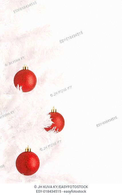 White Christmas tree and red balls, white background