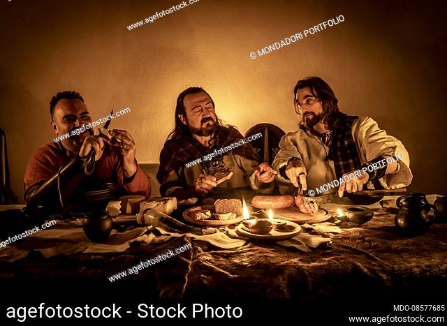 Celts: hypothetical reenactment of the preparation and ongoing of a noble feast. Serving cheese, bread and cured meats as appetizers
