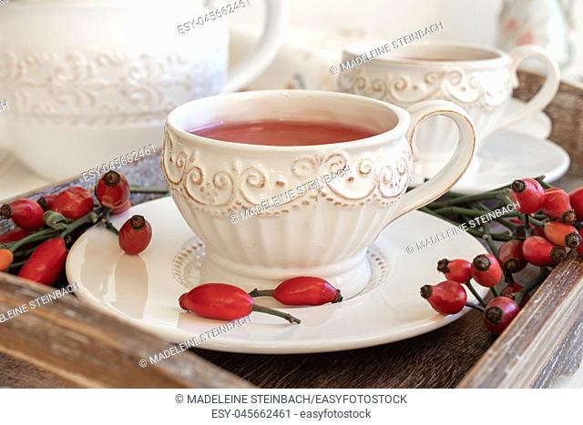 Rose hip tea in a white vintage cup