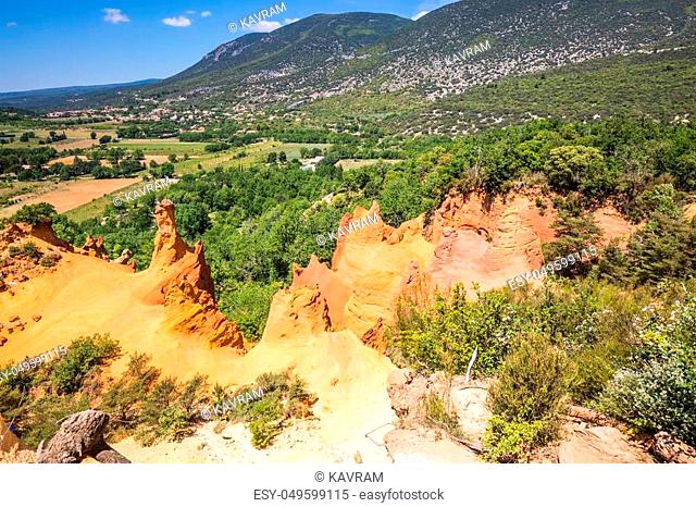 Languedoc - Roussillon, Provence, France. The reserve - pit on production ochre. Orange and red picturesque hills
