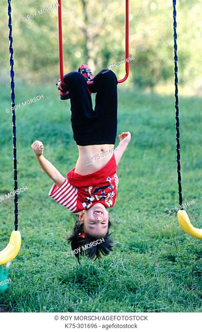 kids hanging upside down
