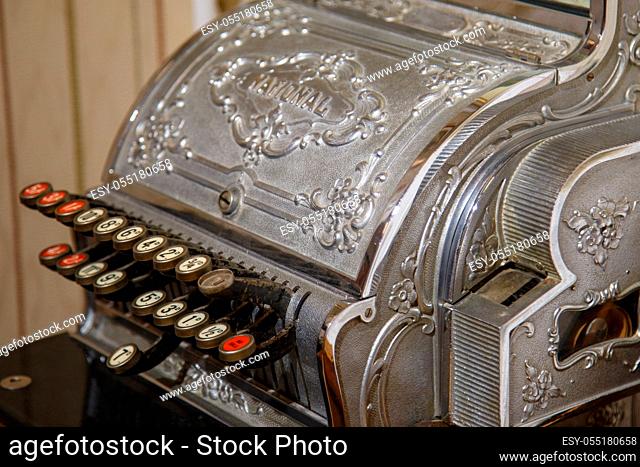 Budapest, Hungary - March 25, 2018: Antique cash register, buttons close up in chocolate museum