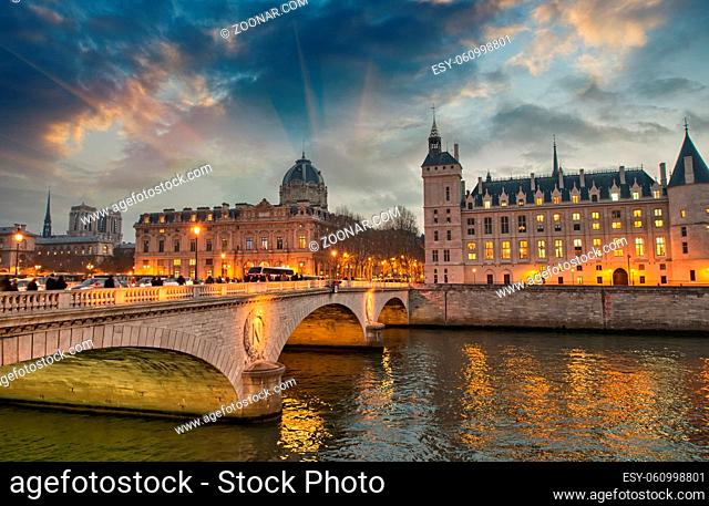 Beautiful colors of Napoleon Bridge at dusk with Seine river - Paris