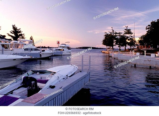 Thousand Islands, Alexandria Bay, New York, St. Lawrence River, NY, Boats at a marina in Alexandria Bay along the St. Lawrence River in the evening
