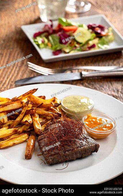 steak with chili and french fries