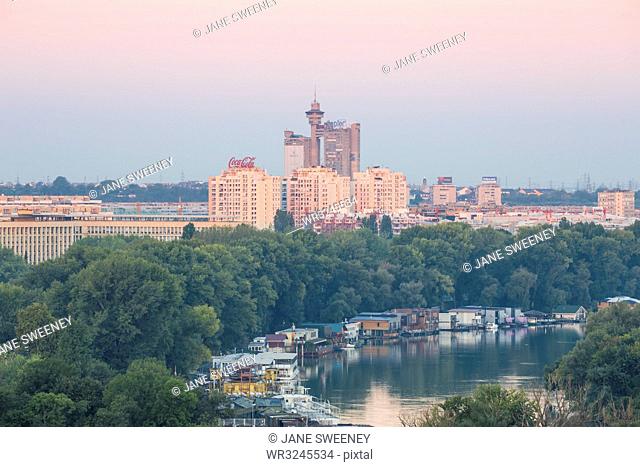 View of the confluence of the Sava and Danube rivers with Genex tower in distance, Belgrade, Serbia, Europe