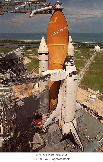 09/07/2000 -- Against a backdrop of the cloudy sky and blue-gray Atlantic Ocean, Space Shuttle Atlantis is revealed after rollback of the Rotating Service...