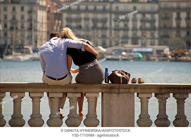 A Couple in love siting in front of Geneva Lake, Geneva, Switzerland
