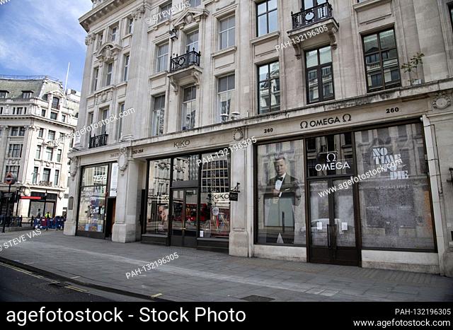 Omega watch shop with advertising for the postponed James Bond film 'No Time to Die' on Regent Street - London's streets and tourist attractions are deserted...