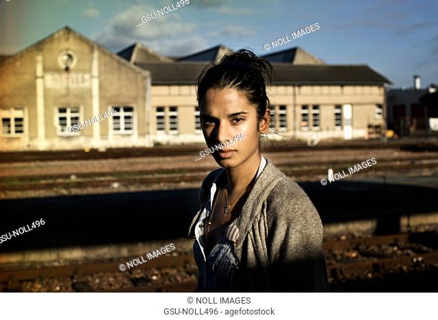 Portrait of Young woman Standing on Train Platform