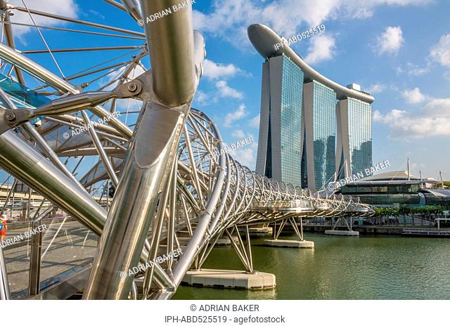 Singapore. The Helix Bridge and Marina Bay Sands Hotel and Casino