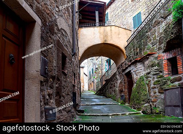 The tufa city of Sorano is a sleeping city from a fairy tale. The narrow streets amidst gloomy stone walls. Italy, southern Tuscany