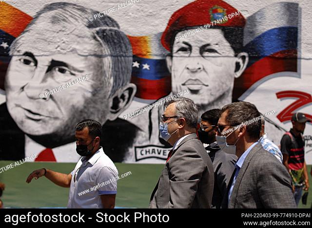 02 April 2022, Venezuela, Caracas: Russian Ambassador to Venezuela Sergei Melik-Baghdazarov (second from right), wearing a protective mask