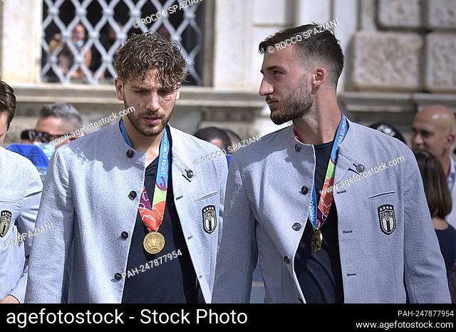 The Italian footballer Manuel Locatelli and Bryan Cristante the UEFA EURO 2020 trophy as players and staff of Italy's national football team arrive to attend a...