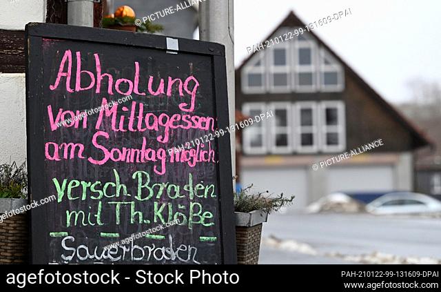 22 January 2021, Thuringia, Harras: ""Pick-up of lunch possible on Sunday"" is written on the sign in front of an inn. Thuringia continues to have the highest...