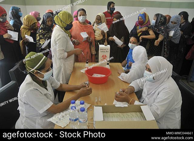 Medical staff prepare a dose of the Sinopharm Covid-19 Vaccine at the M A G Osmani medical college & hospital vaccination center in Sylhet, Bangladesh