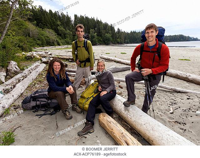 Four friends pose for a photo before embarking on their West Coast Trail adventure. Bamfield, Vancouver Island, British Columbia, Canada