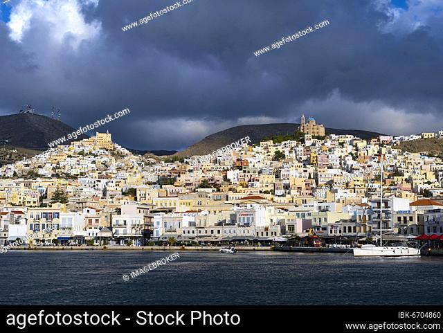 View of the town of Ermoupoli with harbour, on the hill the Basilica of San Giorgio in Ano Syros, and Anastasi Church or Church of the Resurrection, Syros