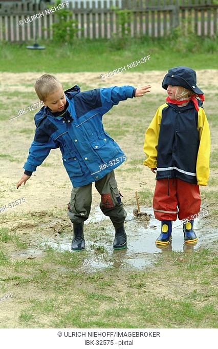 Children play in sludge