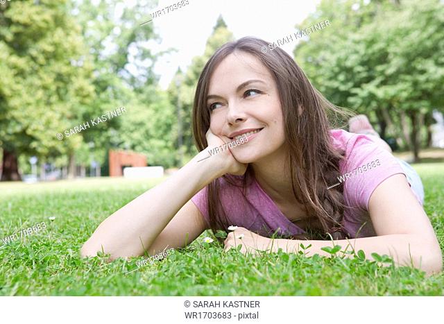 Woman lying on a meadow