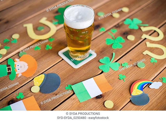 glass of beer and st patricks day decorations