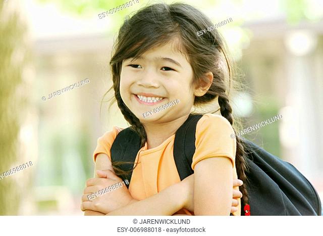 Adorable five year old girl ready for first day of school