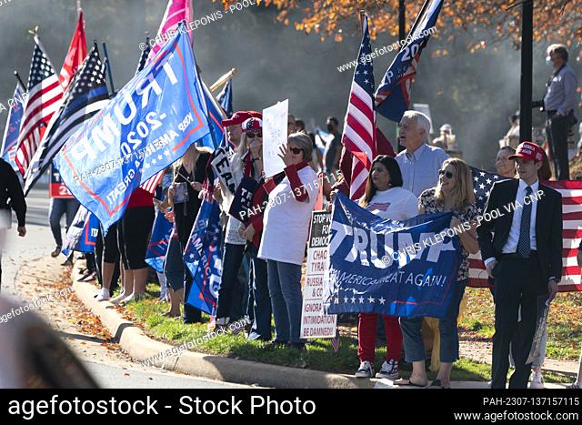 Demonstrators line the street outside the Trump National Golf Club Washington DC in Sterling, Virginia as United States President Donald J