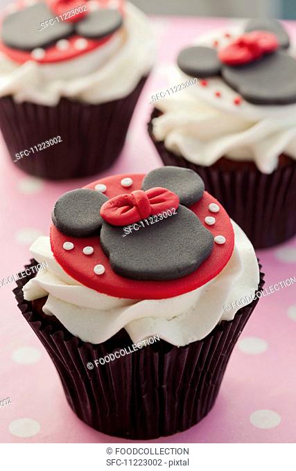 Chocolate cupcake decorated with Minnie Mouse and buttercream