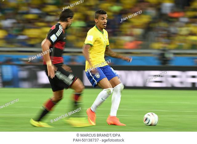 Germany-s Sami Khedira (L) and Brazil's Luiz Gustavo vie for the ball during the FIFA World Cup 2014 semi-final match between Brazil and Germany at the Estadio...