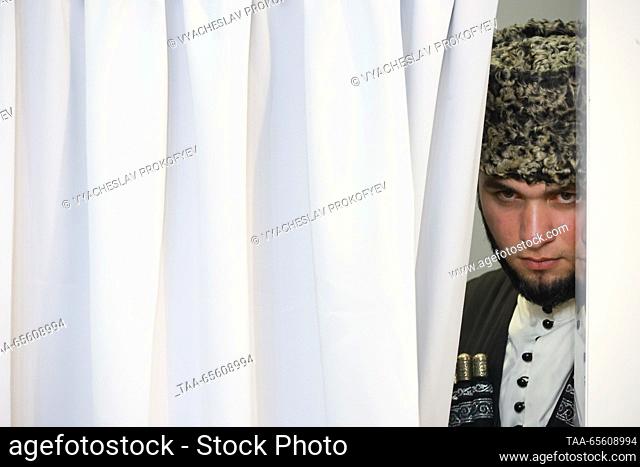 RUSSIA, MOSCOW - DECEMBER 10, 2023: A man wearing a traditional costume is seen at the opening of Chechen Republic Day during the Russia Expo international...