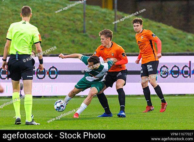 Lommel's Agustin Anello and Deinze's Viktor Boone fight for the ball during a soccer match between KMSK Deinze and Lommel SK, Sunday 20 February 2022 in Deinze