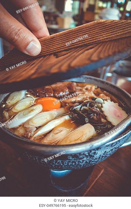 traditional japanese sukiyaki meal hot pot. Close-up view