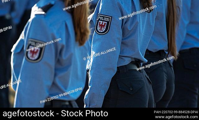 02 July 2022, Brandenburg, Oranienburg: Prospective female police officers stand on the grounds of the police academy on the occasion of their swearing-in...