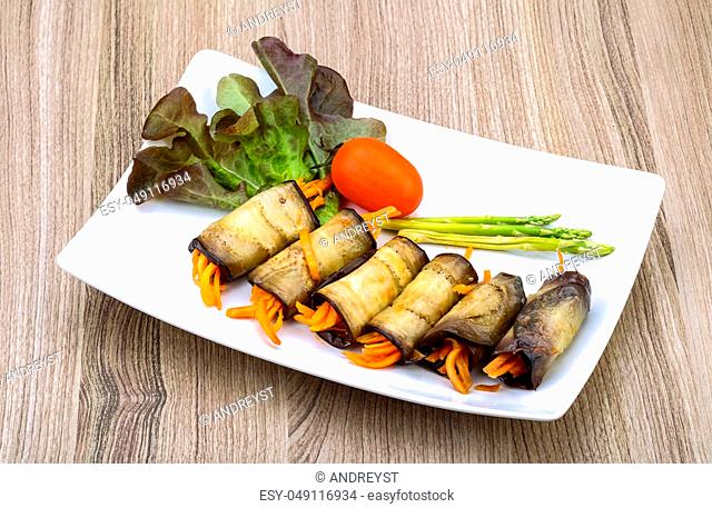 Eggplant rolls with carrot served spices and coriander