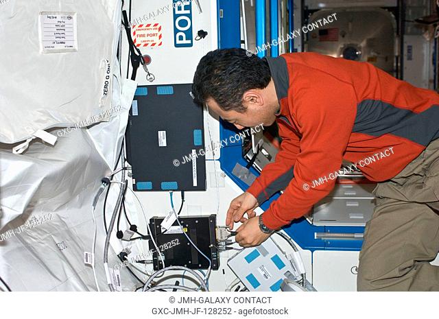 Japan Aerospace Exploration Agency astronaut Satoshi Furukawa, Expedition 29 flight engineer, installs a new T61p laptop to replace the previous A31p as OCA...