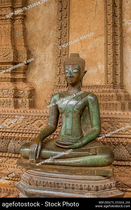 Buddha statue gesturing Varada mudra at a Vat Ho Phra Keo temple, built in 1565, in Vientiane, the capital and largest city of Laos