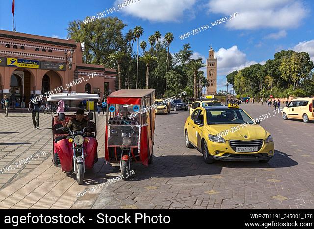 Modes of transport on Jemaa el Fna (Djemaa el Fnaa) Square, UNESCO World Heritage Site & Koutoubia Mosque visible, Marrakesh (Marrakech), Morocco, North Africa
