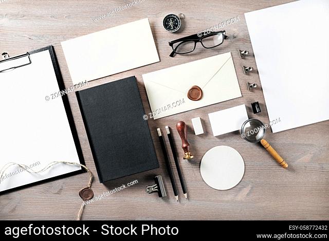 Photo of blank retro stationery on wooden background. Branding mock up. Flat lay