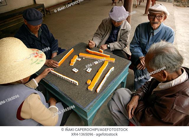 Grandparents playing mahjong, Shaxi, Jianchuan County, Yunnan, China