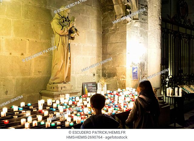 France, Aude, Le Pays Cathare (Cathar country), Carcassonne, old town listed as World Heritage by UNESCO, statue of Saint Antoine de Padoue and candles in Saint...