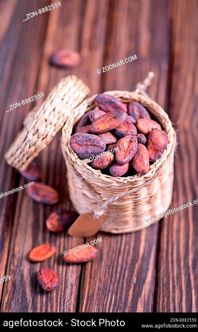 cocoa beans on the wooden table, dry cocoa beans