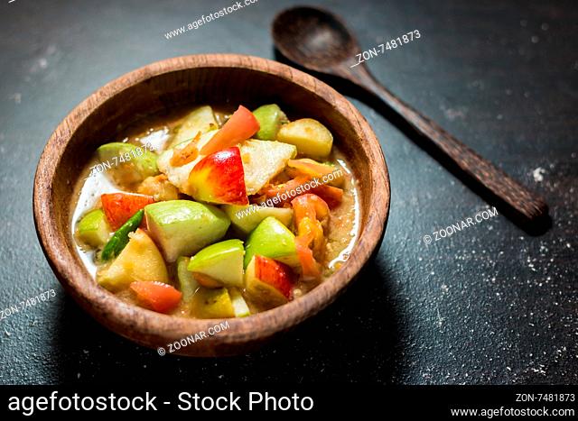 Thai food spicy fruit salad on black table background
