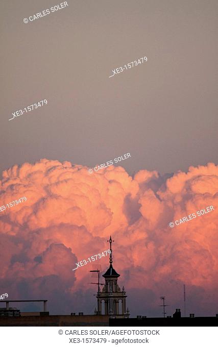 Colored clouds behind the bell tower, Catarroja, Valencia