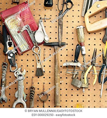 Tools hanging on pegboard