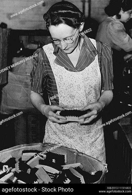 Miss Vera Coleman, machine operator & sorting finished brushes at a Surry Hills brush factory. November 27, 1944
