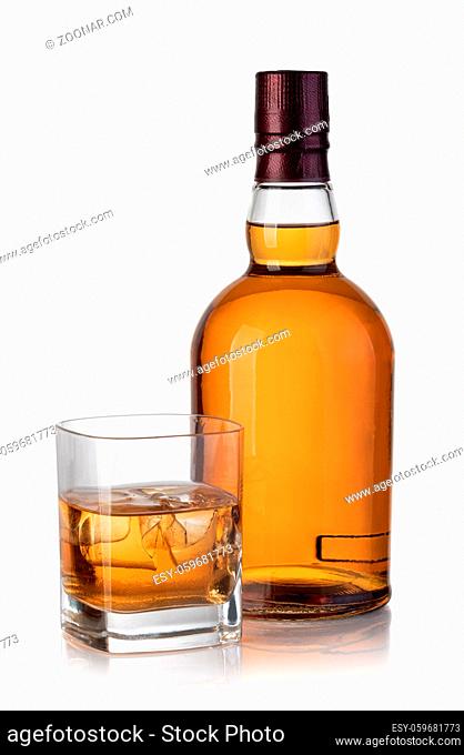 whiskey bottle and glass isolated on white background