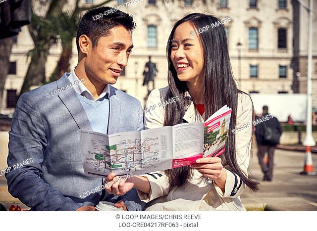 A young Japanese couple sightseeing in London