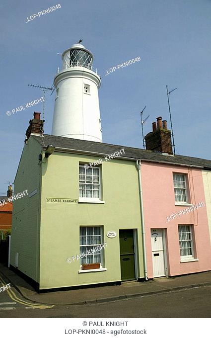 England, Suffolk, Southwold, Houses and Southwold Lighthouse. The Lighthouse station was electrified and automated in 1938