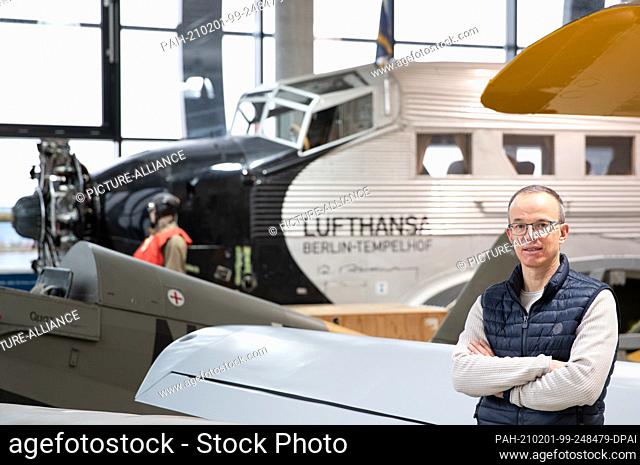 28 January 2021, North Rhine-Westphalia, Büren: Björn Riedesel, Managing Director of Quax Technik GmbH, stands in front of the fuselage of a Junker (Ju 52) in a...