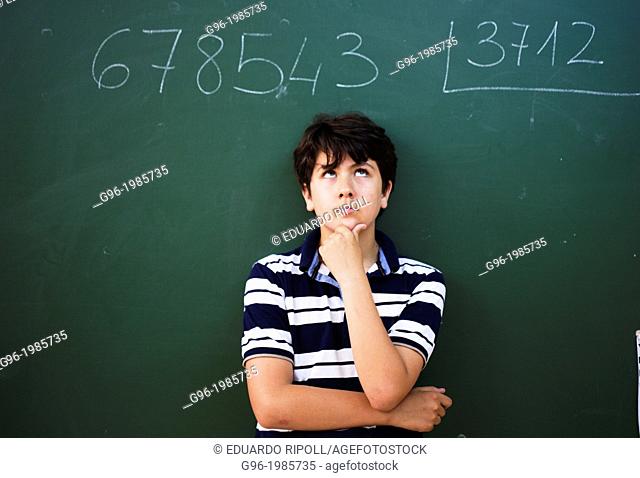 Boy and blackboard at the school